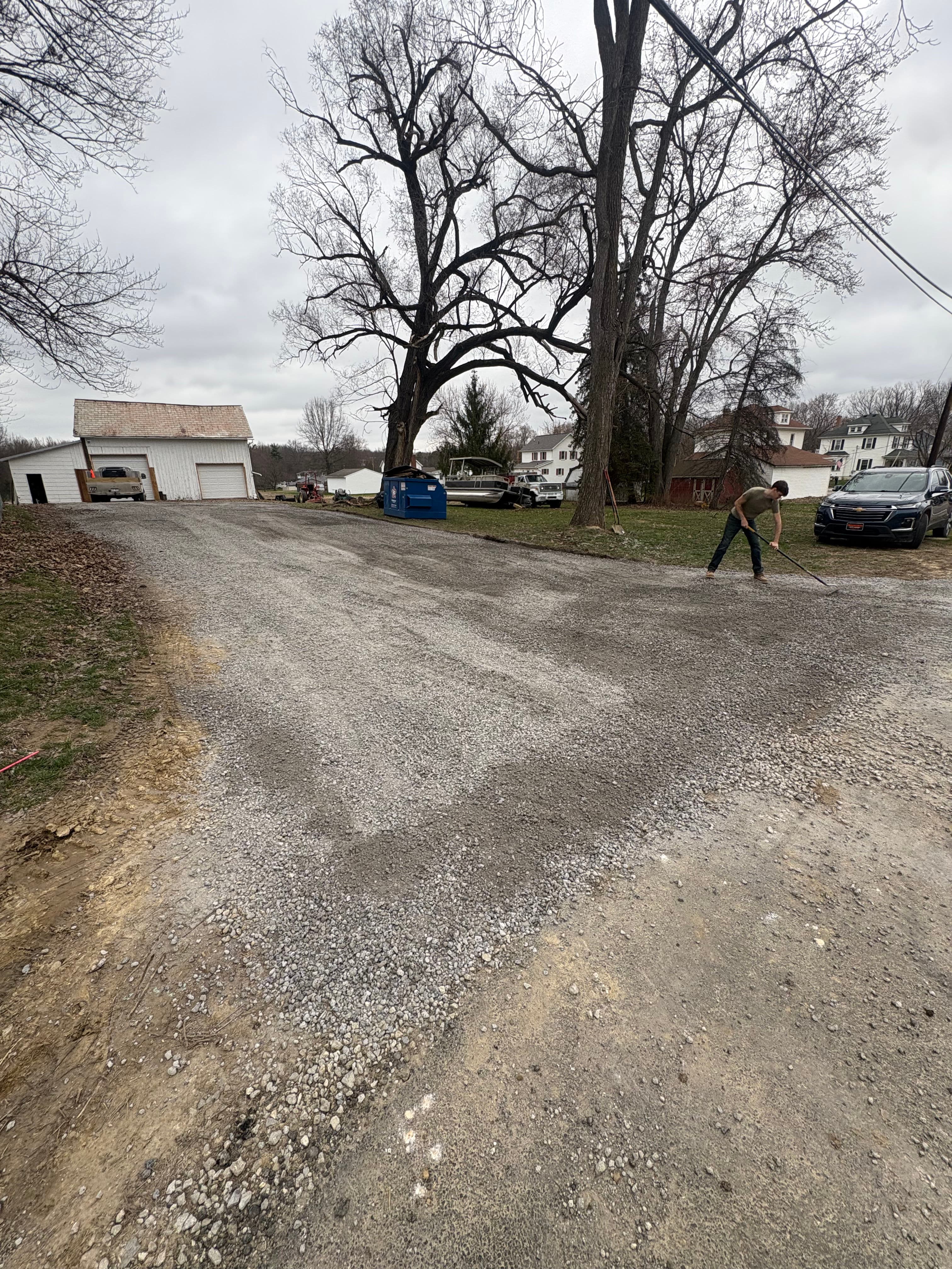 Project Enhancing Driveway Functionality with Gravel and Downspouts image